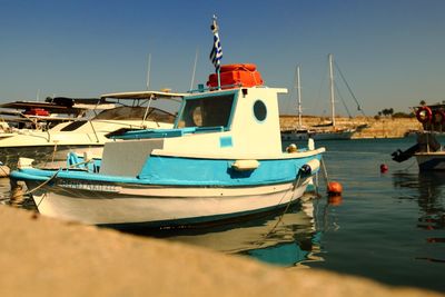 Boats moored at harbor