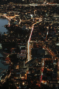 High angle view of illuminated buildings in city at night