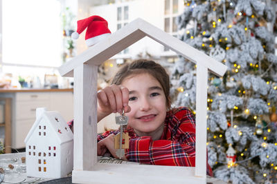 Portrait of boy playing with christmas tree