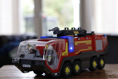 Close-up of toy fire engine on table