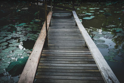 High angle view of boardwalk over lake in forest