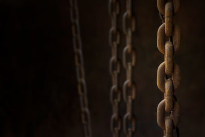 Close-up of chain against wall