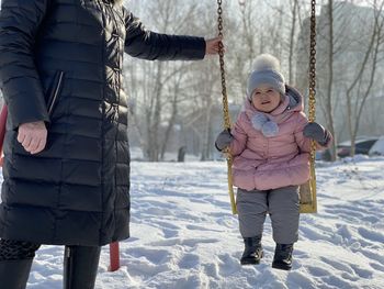Full length of child during winter