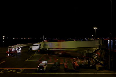 Illuminated airport runway at night
