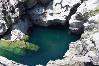 High angle view of rock formations in sea