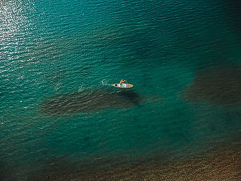 High angle view of people swimming in sea