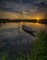 Scenic view of lake against sky during sunset