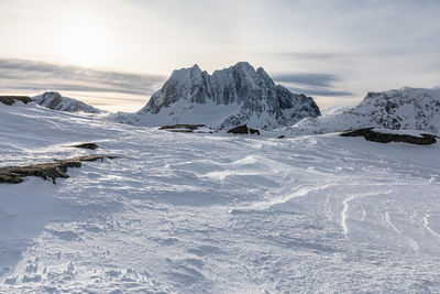 Scenic view of snowcapped mountains against sky