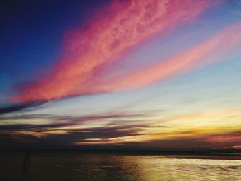 Scenic view of sea against romantic sky at sunset