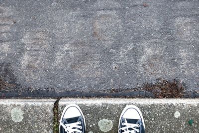 Low section of person standing on ground