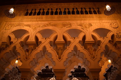 Low angle view of illuminated ceiling