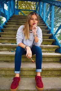 Young woman sitting on steps