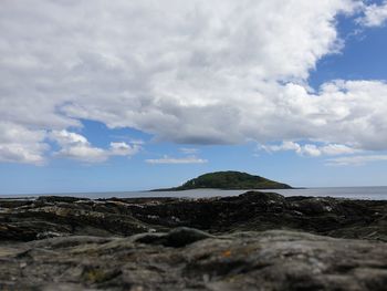 Scenic view of looe island sea against sky