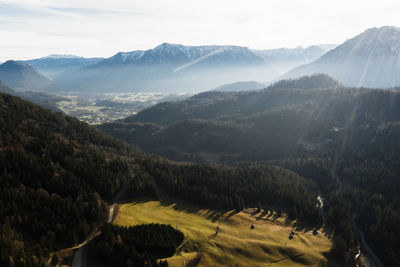 Scenic view of landscape and mountains against sky