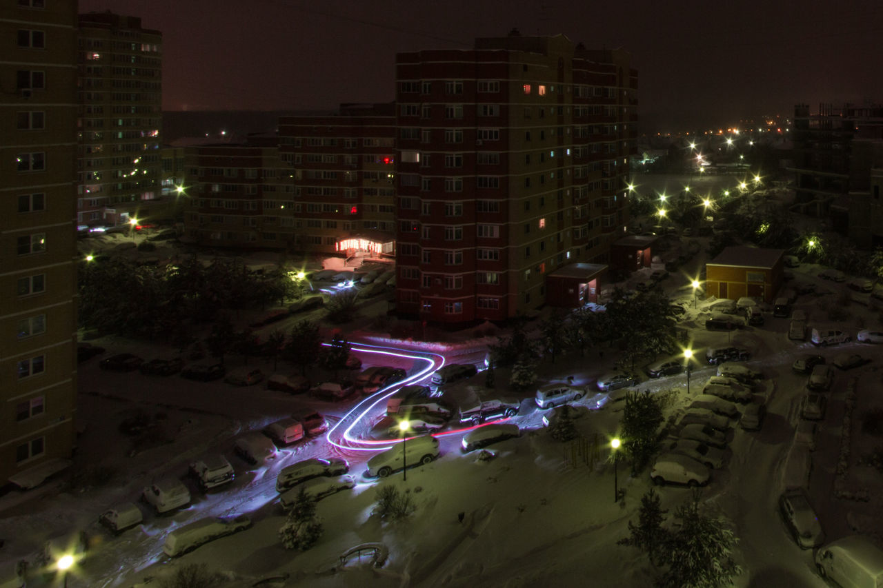 HIGH ANGLE VIEW OF ILLUMINATED CITYSCAPE