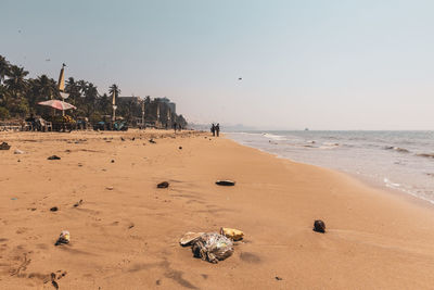 Scenic view of beach against clear sky