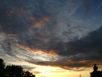 Low angle view of dramatic sky during sunset