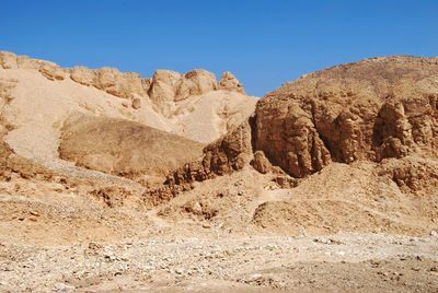 Rock formations in desert against sky