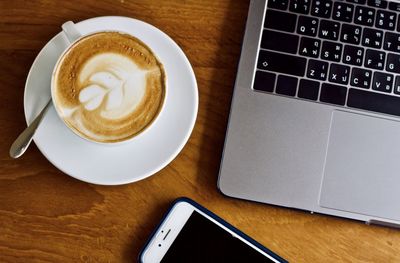 High angle view of coffee cup on table