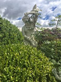 Low angle view of statue against sky