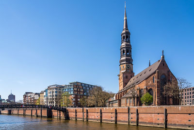 View of buildings against blue sky