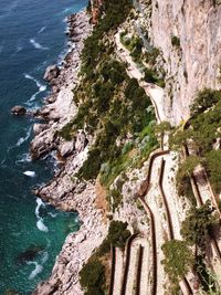 High angle view of rock formation by sea