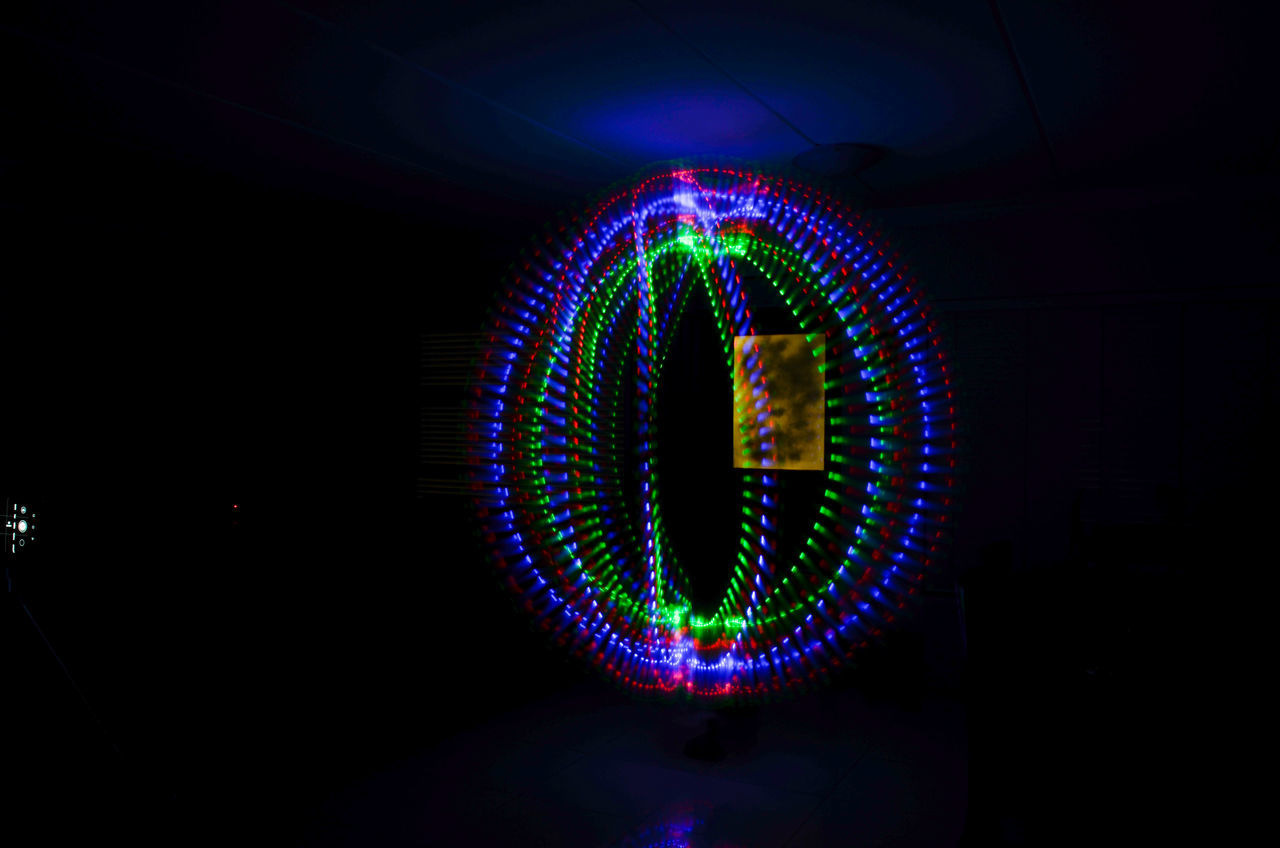 illuminated, light, night, multi colored, glowing, neon, circle, lighting equipment, no people, light - natural phenomenon, long exposure, neon sign, darkness, communication, technology, indoors, shape, motion