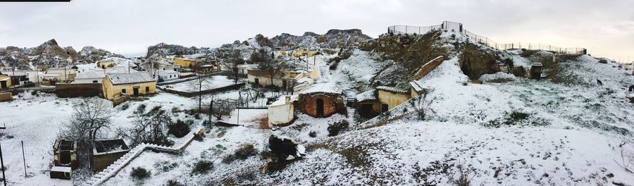 Panoramic view of snow covered mountain against sky