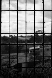 Full frame shot of field seen through window