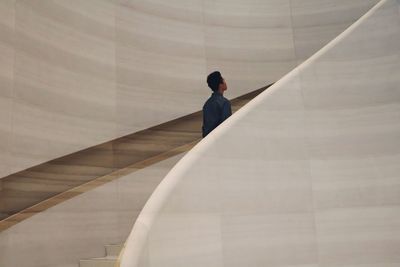 Rear view of man on staircase