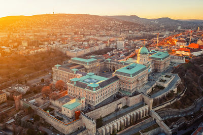Sunset view of parliament, buildings and city. dramatic evening view in budapest, hungary, europe
