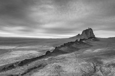 Scenic view of shiprock, nm against sky