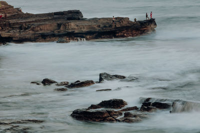 Scenic view of rocks in sea