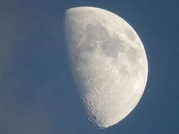 Low angle view of moon against clear sky at night