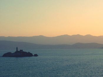 Scenic view of sea at sunset