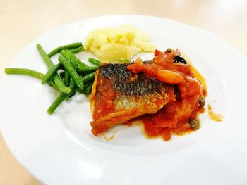 Close-up of fish served in plate on table