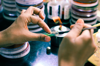 Close-up of person hands experimenting in laboratory