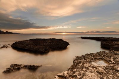 Scenic view of sea against sky during sunset