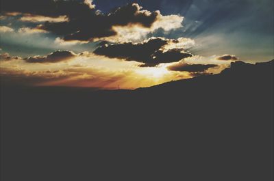 Scenic view of cloudy sky at sunset