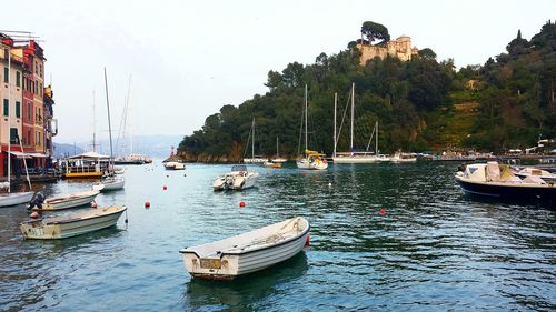 Boats moored in sea