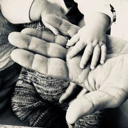 Close-up of baby hand on father palm