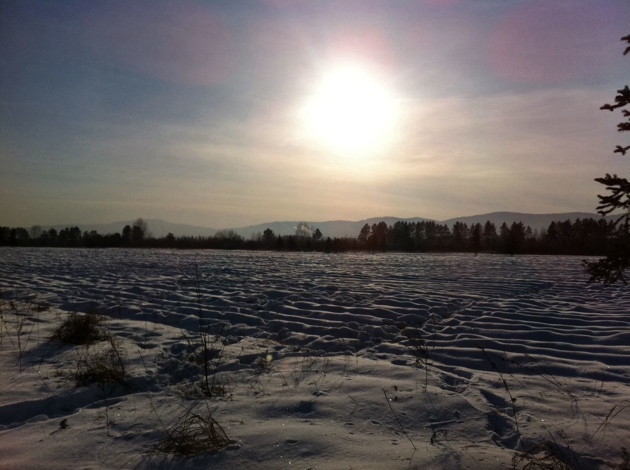 winter, snow, cold temperature, tranquil scene, tranquility, sun, scenics, beauty in nature, nature, water, sky, sunlight, frozen, weather, season, sunbeam, lake, landscape, sunset, idyllic