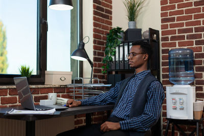 Businessman sitting at desk in office