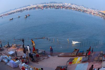 High angle view of people on boats in sea