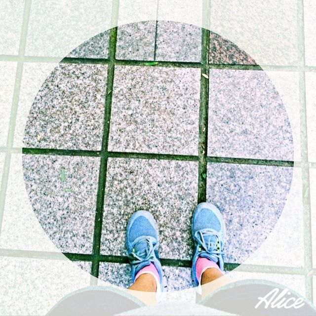 circle, indoors, geometric shape, pattern, tiled floor, low section, tile, shoe, directly above, shape, high angle view, design, white color, flooring, standing, built structure, day, architecture, person, wall - building feature