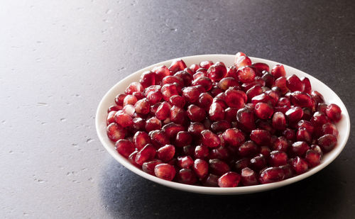 High angle view of strawberries in bowl on table