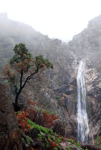 Scenic view of waterfall on mountain