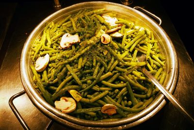 High angle view of green beans with mushrooms served on table