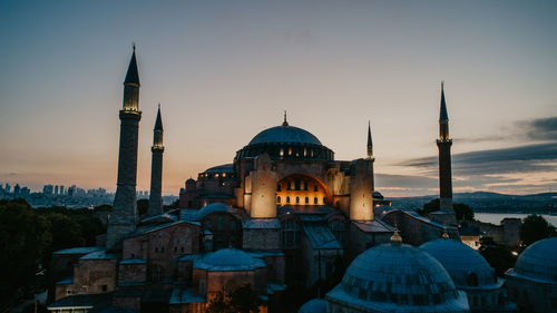 View of buildings against sky at sunset