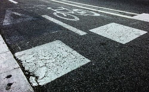 High angle view of bicycle lane sign on street